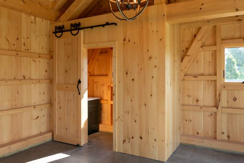 4' x 9' Interior Partition Wall with 3' x 7' Sliding Door conceals the bathroom