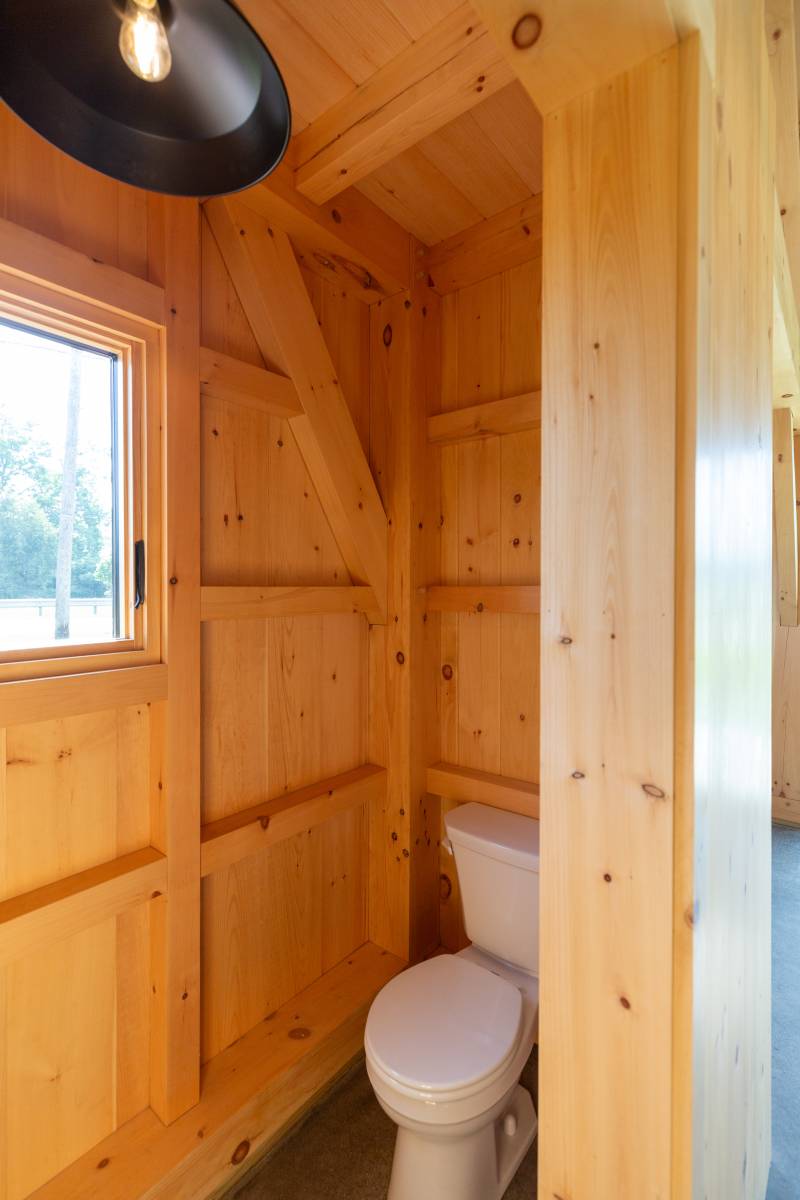 The enclosed bathroom is convenient for guest use