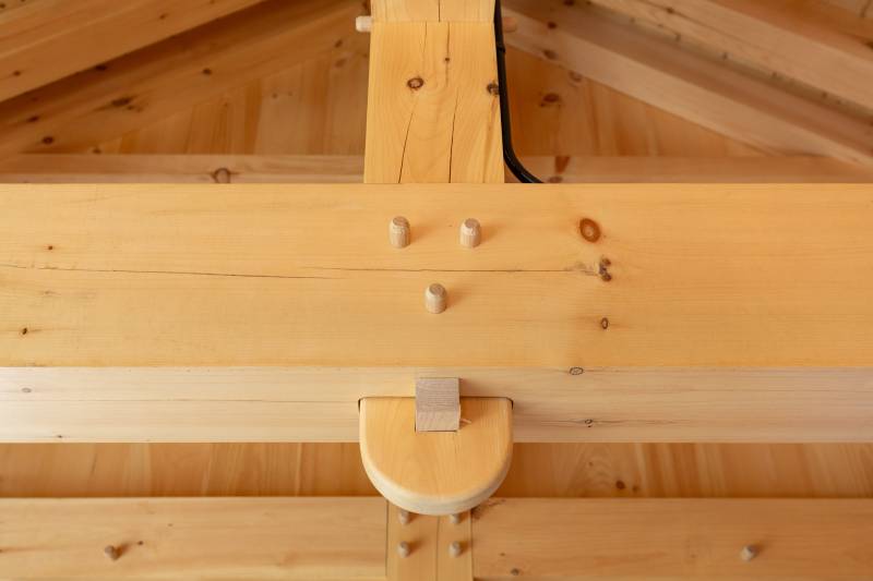 Close-up of wedged anchorbeam tenon joinery