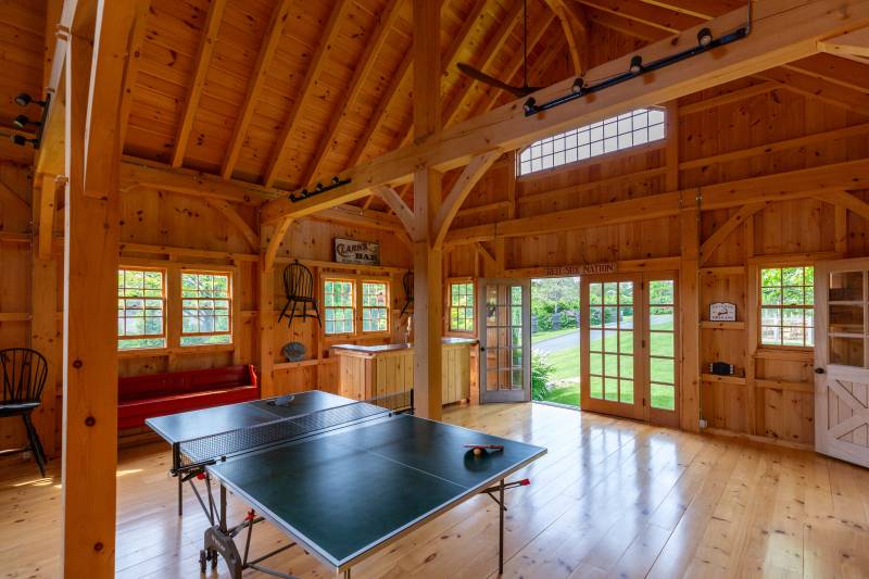 Divided light windows & a double door with sidelights let plenty of light into the barn