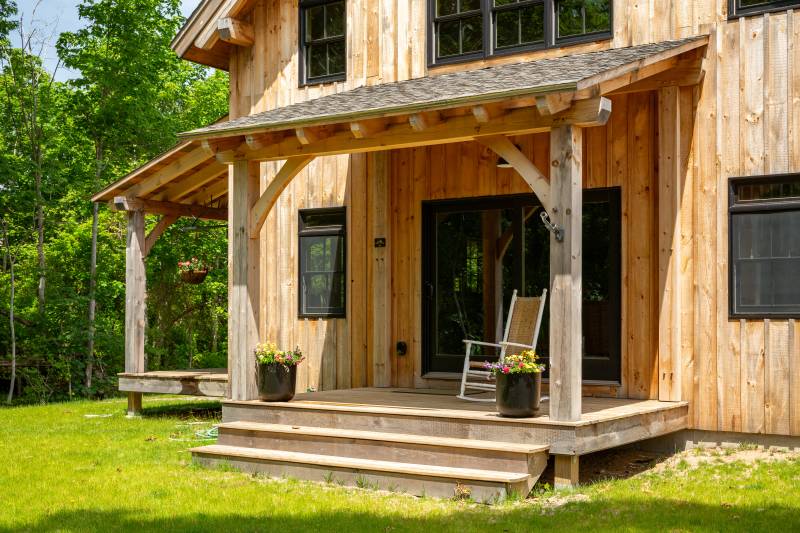 A rustic entryway welcomes you to the barn home