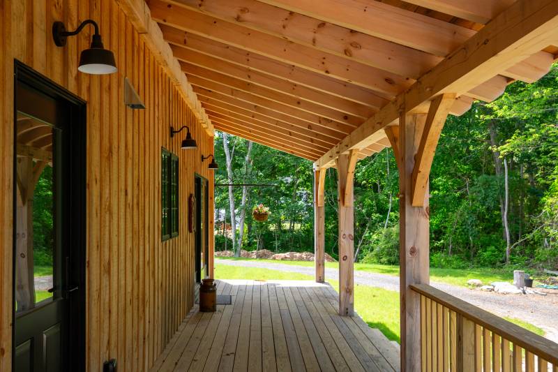 Underneath the timber frame covered porch 