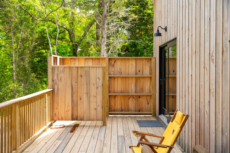 The wrap-around deck has an outdoor shower space