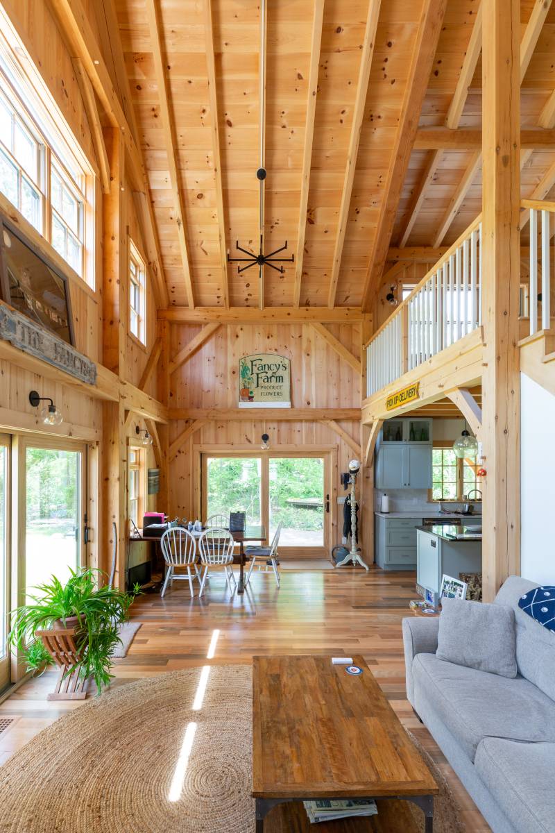 The timber frame barn home has a rustic farmhouse feel