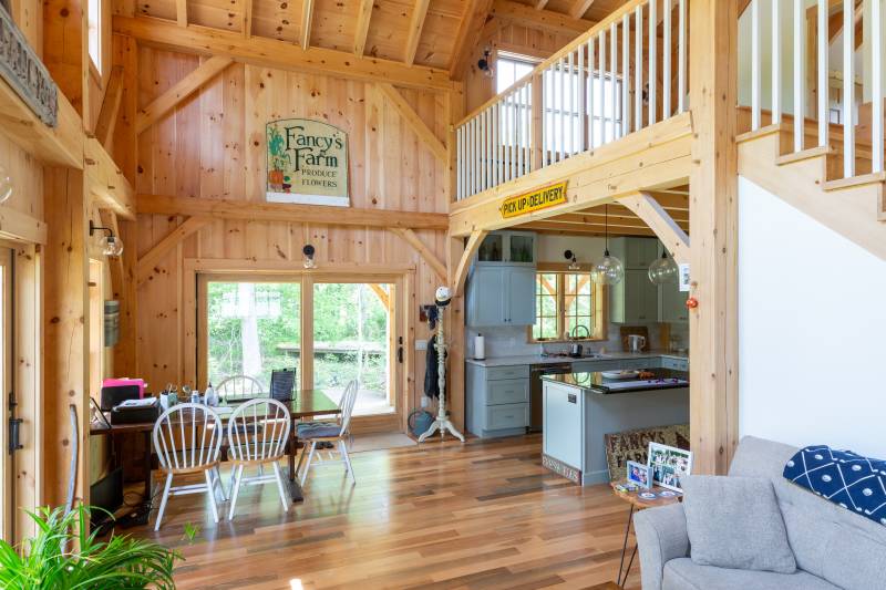 An open dining area, and farther in, the kitchen