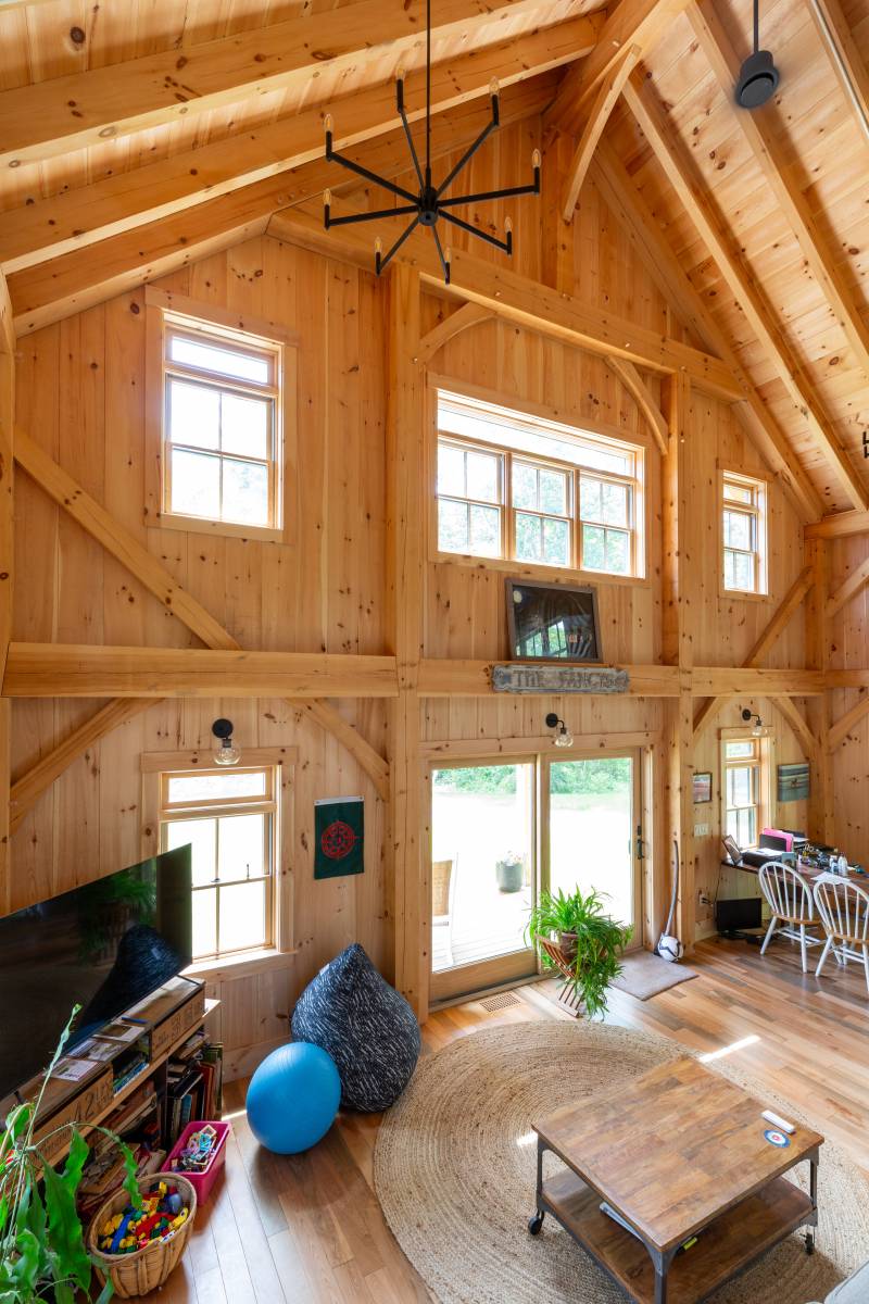 The post & beam barn home’s timbers are on display throughout the open interior