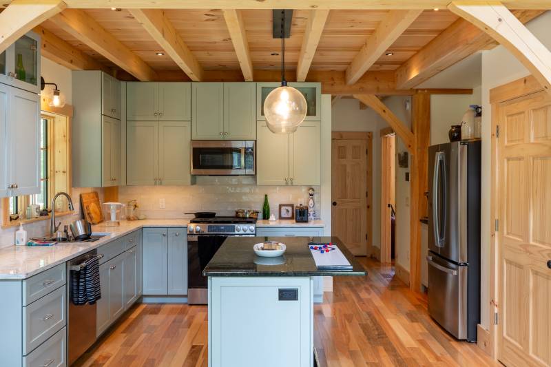 The light colors stand out against the barn home’s warm pine interior