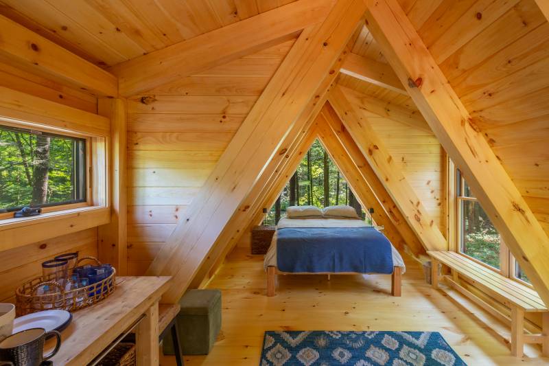 Both shed dormers provide extra space and natural light inside the cabin