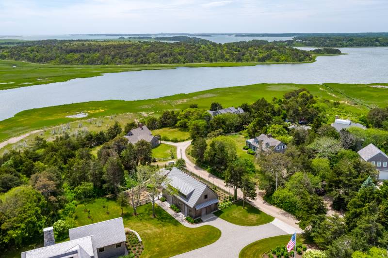 Waterfront views surround this post & beam barn