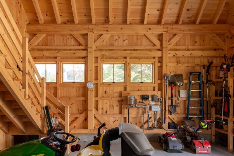 This post & beam barn is tidy and functional, with space for equipment, tools, and more