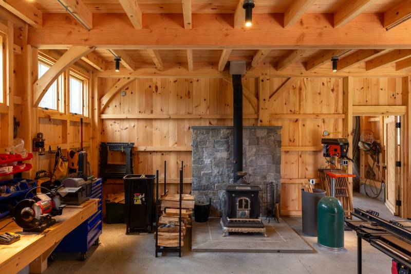 A wood stove keeps the workshop warm in the colder months