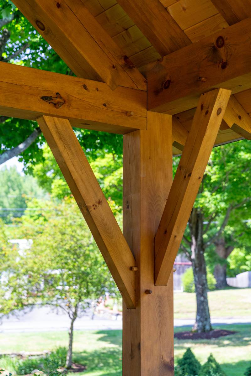 A closer look at the knee brace joinery supporting a truss and rafter plate