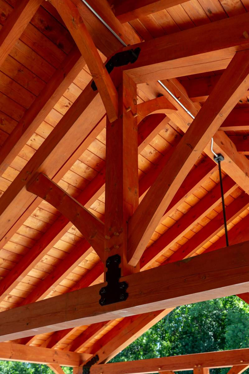 A closeup of the king post timber trusses
