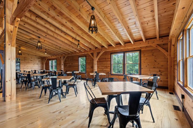 Seating in the enclosed lean-to of the timber frame building