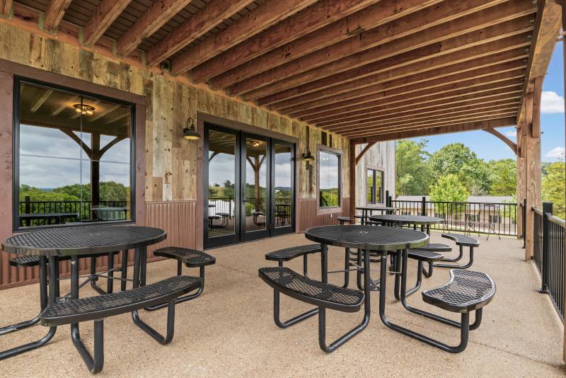 Outdoor seating on the deck with timber frame overhang