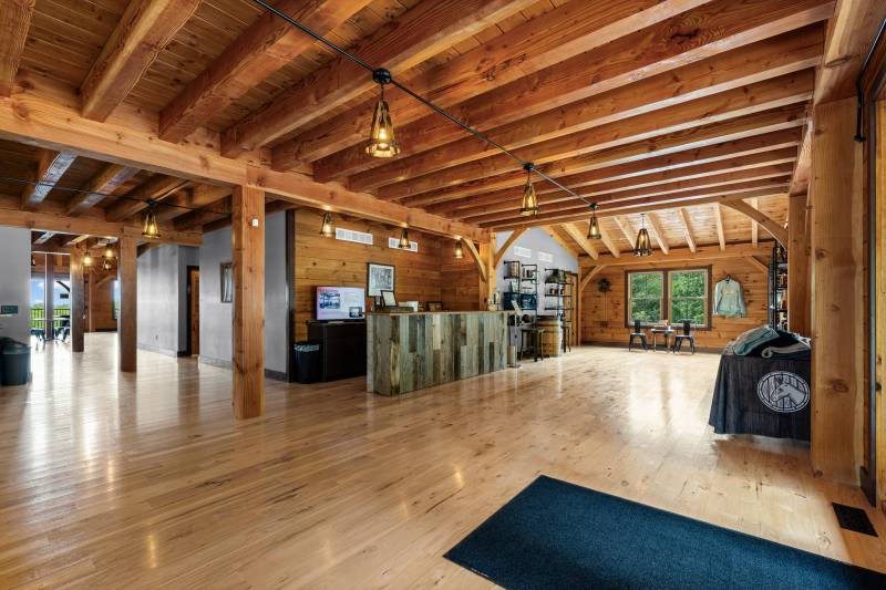 Lighting made from bourbon barrels brings charm to the post & beam interior