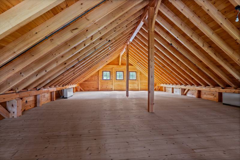 The timber frame barn has a gallery-style loft
